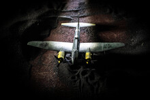 German Junker (Ju-88) Night Bomber At Night. Artwork Decoration With Scale Model Of Jet-propelled Plane In Possession.