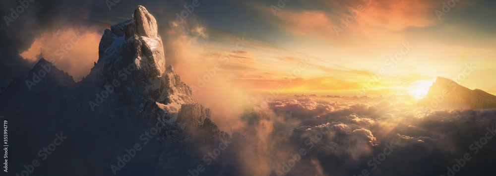 Beautiful aerial landscape of mountain peak at sunset above the clouds - panoramic - obrazy, fototapety, plakaty 
