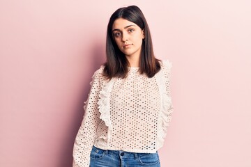 Young beautiful girl wearing casual clothes standing over isolated pink background