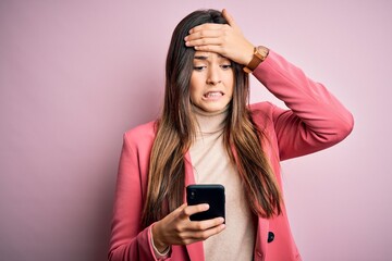 Poster - Young beautiful girl having conversation using smartphone over white background stressed with hand on head, shocked with shame and surprise face, angry and frustrated. Fear and upset for mistake.