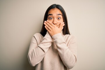 Sticker - Young beautiful asian woman wearing casual turtleneck sweater over white background shocked covering mouth with hands for mistake. Secret concept.