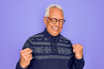 Sticker - Middle age senior grey-haired man wearing glasses and winter sweater over purple background excited for success with arms raised and eyes closed celebrating victory smiling. Winner concept.