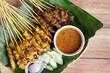 Satay is a popular Malaysia / Indonesia dish of seasoned, skewered and grilled chicken and meat, served with peanut sauce.
