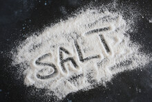 Iodized Salt Isolated On A Dark Surface, Healthy Nutrition