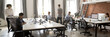Leinwandbild Motiv Group of multi ethnic corporate employees working in co-working open space walking in motion, sit at shared desks. Busy workday, office rush concept. Horizontal photo banner for website header design