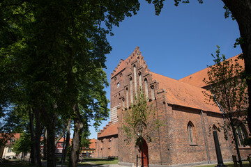 Wall Mural - Old red church in køge with blue sky