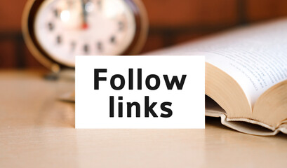 Follow links business concept text on a white book and clock