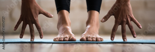 Fotografía Horizontal photo banner for website header design sportive woman performing forward bend practising yoga uttanasana asana pose