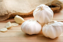 Garlic Bulb Head And Cloves On Wooden Floor, Herbs And Spices Are Important In Cooking