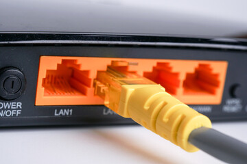 WiFi Modem Router ADSL connected with LAN RJ45 Cable. It is a LAN network connection ethernet cable. Internet cord RJ45
