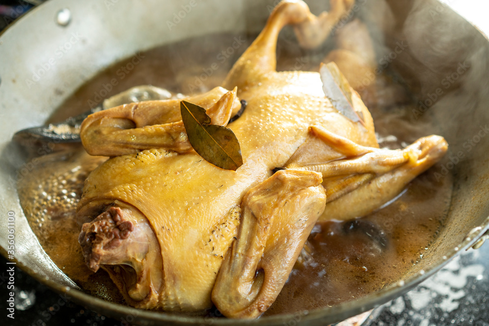 Braised duck being made in the pot, boiling soup water Stock Photo ...