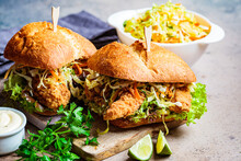 Crispy Fried Chicken Sandwiches With Coleslaw Salad On The Board.