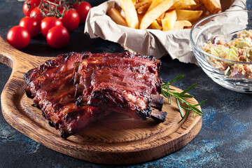 Wall Mural - Spicy barbecued pork ribs served with BBQ sauce