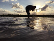 © NASRUDEEN - man running on the beach at sunset