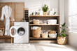 © New Africa - Modern washing machine and shelving unit in laundry room interior