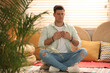 © New Africa - Man during self-healing session in therapy room