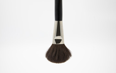 black fluffy brush for makeup artist on a white background