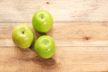 Ripe tasty apples on a wooden table. Healthy food