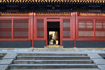 Wall Mural - Red wooden window and door, decoration colorful painting beam and wood pole from ancient china palace in forbidden City, Beijing, China