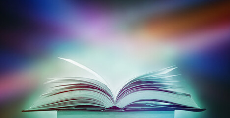 Poster - the blurred book that is bewitched with magic, the magic light in the dark, with the bright light sh