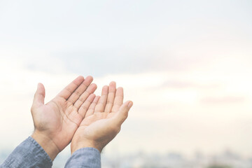 Wall Mural - Human hands open palm up worship Praying hands with faith and belief in God of an appeal to the sky. Concept Religion and spirituality with believe Power of hope or love and devotion.