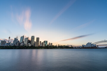 Fototapete - Sydney downtown skyline during sunset at Sydney harbor bay, NSW, Australia