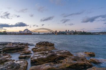 Fototapete - Sydney harbor skyline at sunset with Sydney harbor bridge, NSW, Australia