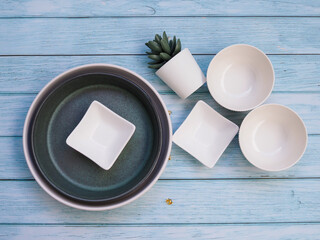 Wall Mural - white ceramics tableware with bowl plate or round dish and crockery set on wooden table.