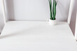 © VetalStock - minimalist white desktop with decorative plant