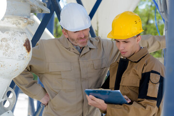 portrait image of two man engineers outdoors