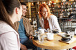© BalanceFormCreative - Group of friends hangout  in city cafe  and talking.