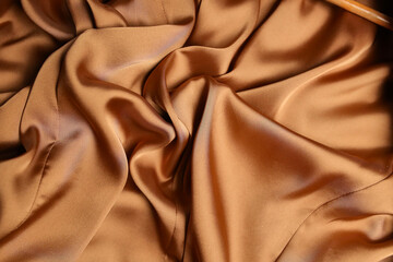 The fabric is silk. Silk drapery. The silk is beige. The cloth