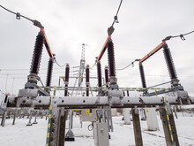 Power transmission system during winter. High voltage disconnector.