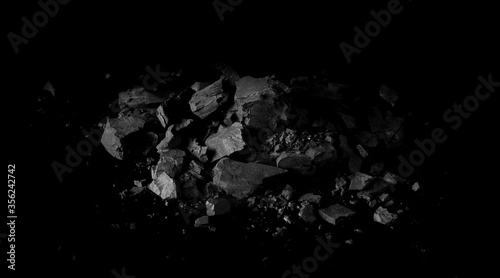 Fotografía Pile black coal isolated on black background, clipping path
