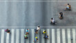 © ultramansk - Human life in Social distance. Aerial top view with blur man with smartphone walking converse with busy city crowd move to pedestrian crosswalk