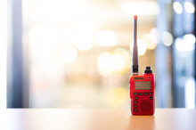 A Red Walkie Talkie Or Portable Radio Transceiver For Communication.