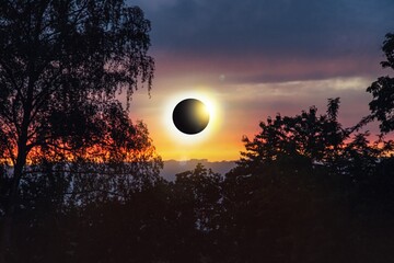Wall Mural - Colorful eclipse of the Sun in clouds sky , apocalypse sunset