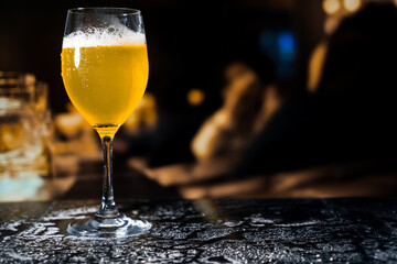 Beer glass on the bar counter.