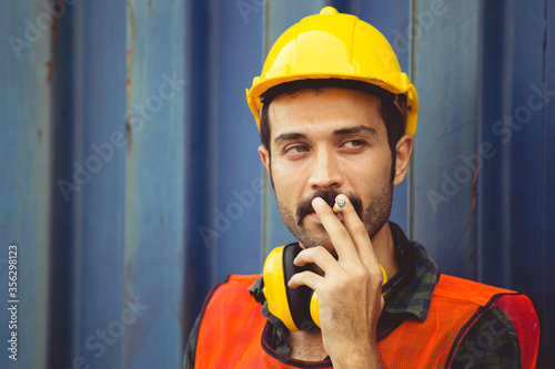 Fotografía Worker with a cigarette smoke break, Labour takes a cigarette break