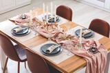 Fototapeta Miasto - Served table in modern dining room