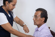 © Teran - mexican nurse taking vital signs to patient  isolated
