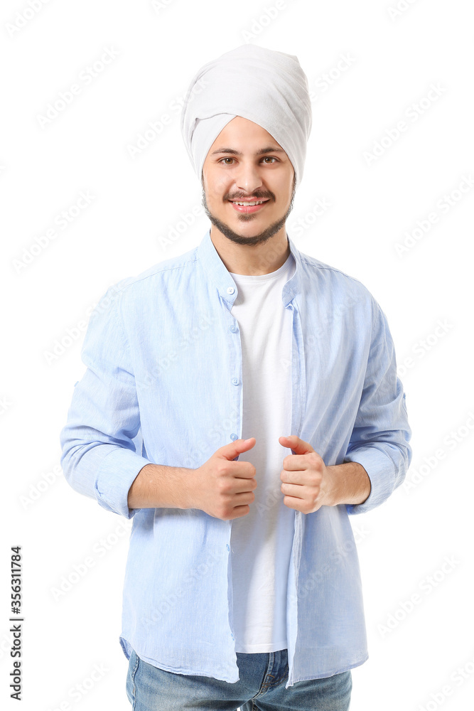 Handsome young Indian man on white background
