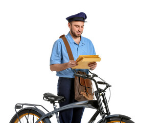 Canvas Print - Handsome young postman with bicycle on white background