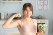 © Pixel-Shot - Sporty young woman with healthy salad in kitchen