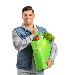 Wall Mural - Young man holding bag with food on white background