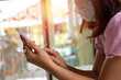 © maeching - women holding smart phone making online shopping and banking payment