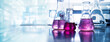 purple glass flask in blue research chemistry science banner laboratory background