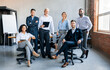 © Prostock-studio - Coworkers Smiling To Camera Posing In Modern Office