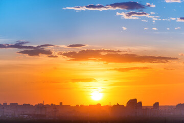 Canvas Print - Sunset in big city, landscape with dramatic sky, clouds and sun rays