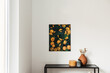 © Floral Deco - Modern interior design concept. Oil painting canvas with oranges on the wall. Candle, clay pot with dry plants.